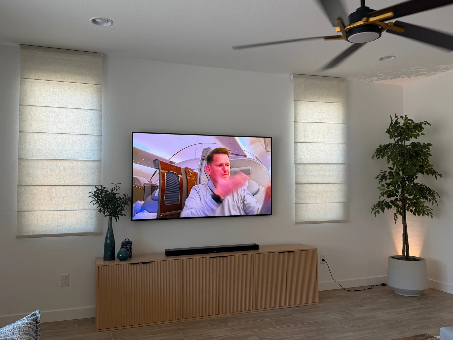 Roman shades installed on two living room windows
