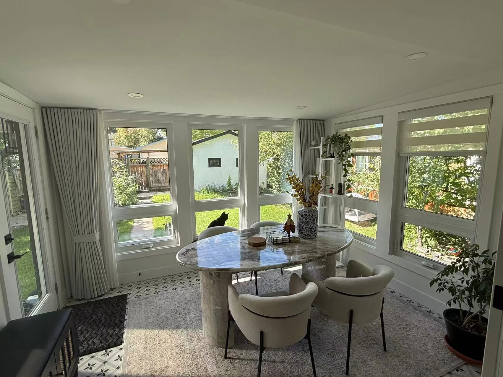 Zebra shades installed in a bright dining area